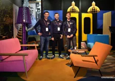 Rick Bremer, Robert op 't Land, and Kees Noordmans (from left to right) in the colorful booth of OPNIEUW!, specializing in second-hand furniture that they revitalise into refurbished furniture for offices.