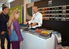 Randolf van Kuik (right) actively engaged in conversation with visitors at his booth. On behalf of the textile manufacturer, he showcased the new Zimmer+Rohde collection.