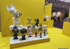 The French brand Leblon Delienne had a bright yellow stand with decorative cartoon art pieces.