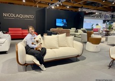 Eglantina on the durable sofa by NicolaQuinto (Italy) , holding a teddy bear made of the same fabric as the sofa.