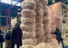 Lavish presentation of bouclé poufs at the PH Collection booth.